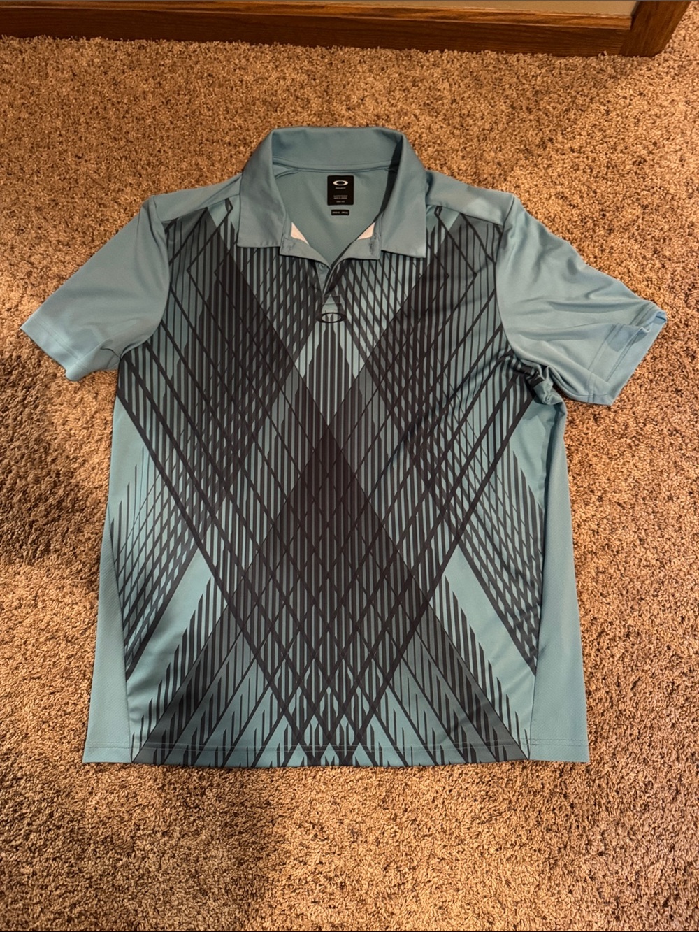 Oakley Men's Sky Blue Polo with Dark Geometric Print